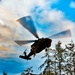 1-230th Assault Helicopter hovers to retrieve injured 'hiker' in joint exercise
