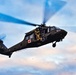 Tennessee National Guard Blackhawk hovers for medics to descend in joint exercise
