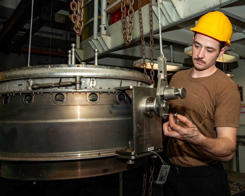 Sailor Removes Gain Drain Lines From Jet Engine