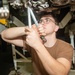 Sailor Removes Gain Drain Lines From Jet Engine