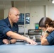 U.S. Navy Sailor Helps Sailor File Paperwork