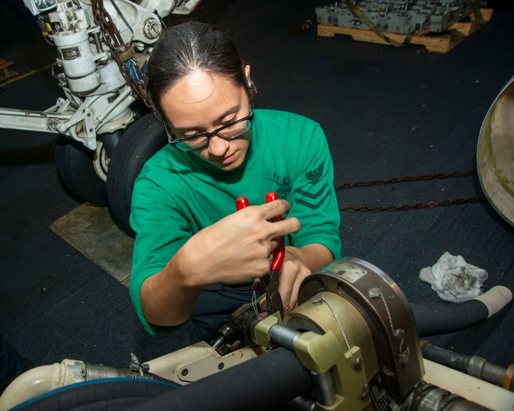 Sailor Tightens Screws On Aerial Refueling Store Pod