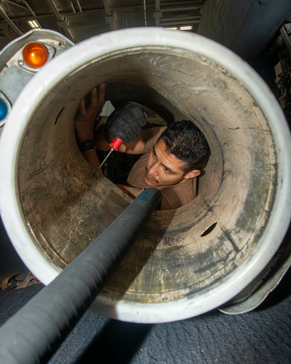 Sailor Tightens Screws On Aerial Refueling Store Pod