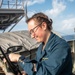 Sailor Prepares To Raise Signal Flag