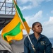 Sailor Prepares To Raise Signal Flag