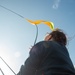 Sailor Prepares To Raise Signal Flag