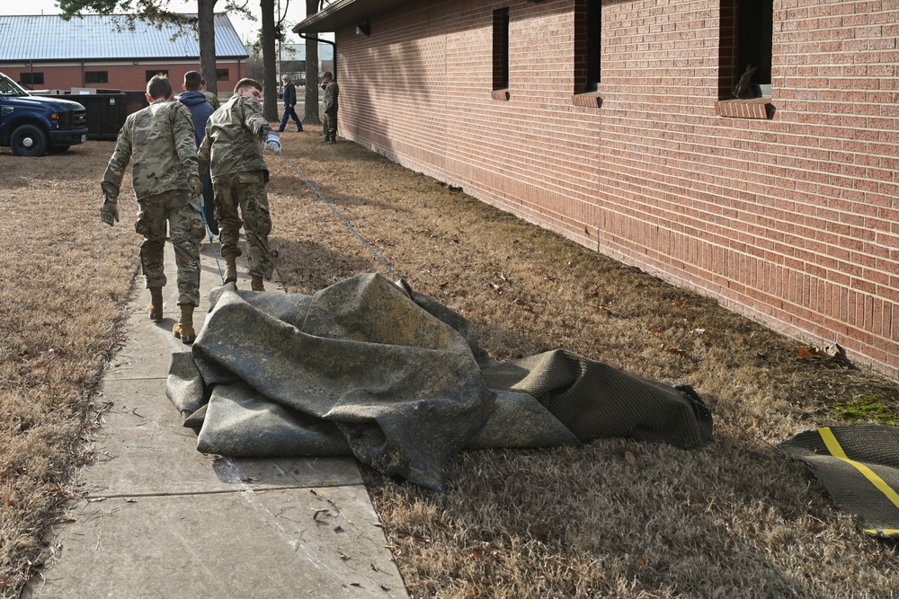 Team Little Rock Airmen Remove Storm Damaged Materials From Building