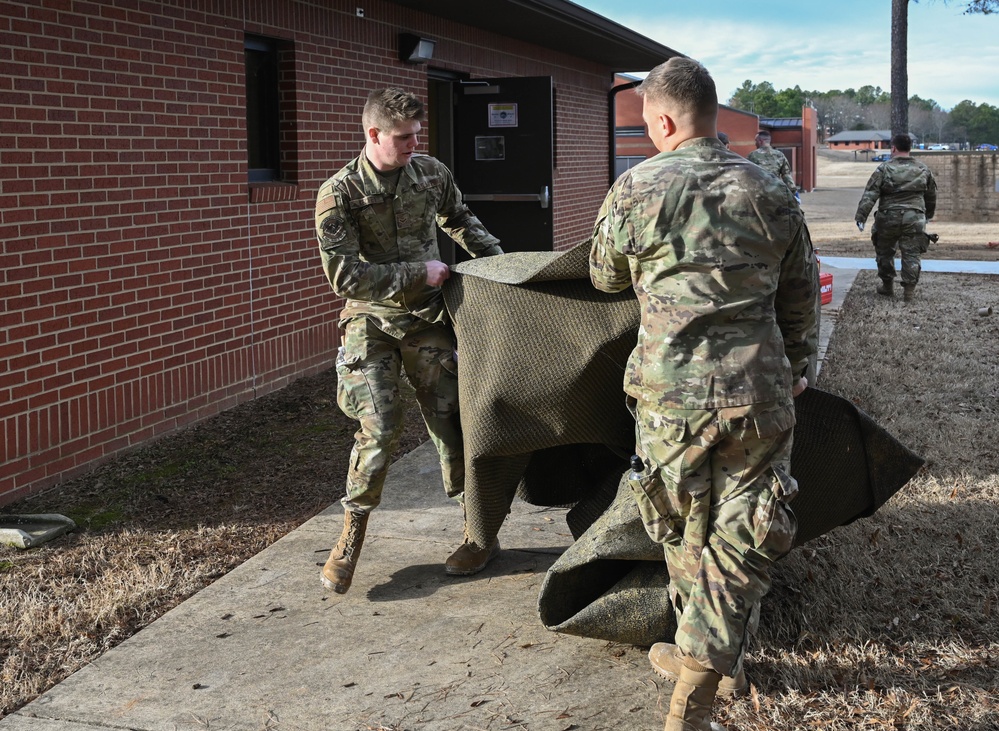 Team Little Rock Airmen Remove Storm Damaged Materials From Building