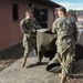 Team Little Rock Airmen Remove Storm Damaged Materials From Building