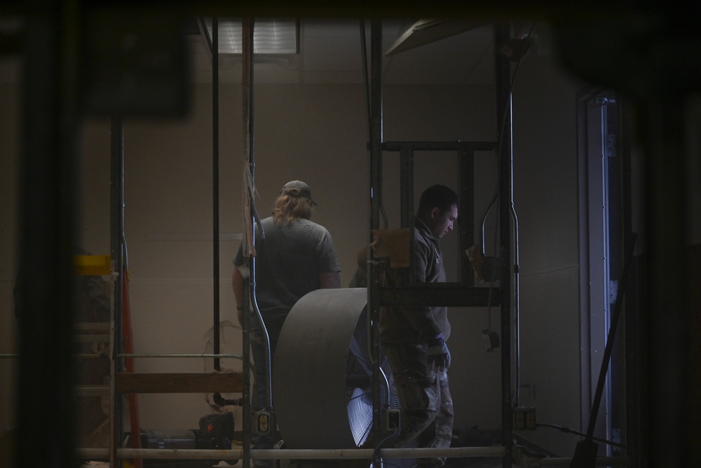 Team Little Rock Airmen Remove Storm Damaged Materials From Building