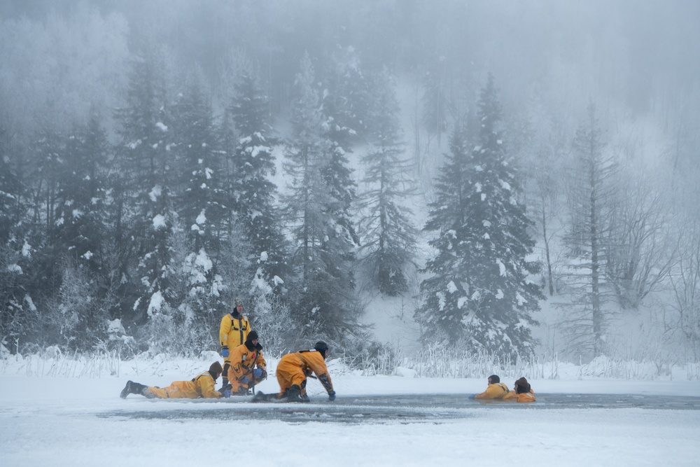 JBER firefighters take a plunge for ice water rescue training