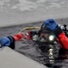 Firefighters on installation fire department dive team participate in ice rescue training at frozen lake at Fort McCoy