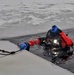 Firefighters on installation fire department dive team participate in ice rescue training at frozen lake at Fort McCoy