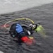 Firefighters on installation fire department dive team participate in ice rescue training at frozen lake at Fort McCoy