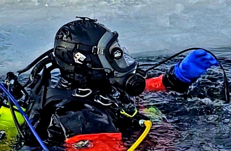 Firefighters on installation fire department dive team participate in ice rescue training at frozen lake at Fort McCoy