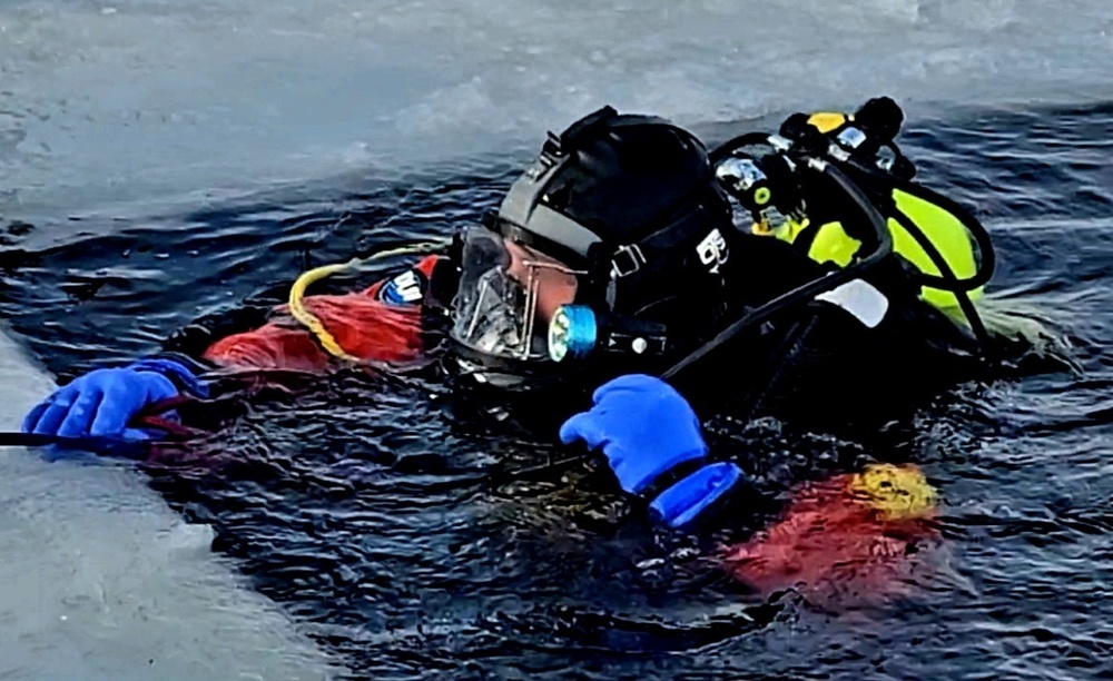 Firefighters on installation fire department dive team participate in ice rescue training at frozen lake at Fort McCoy