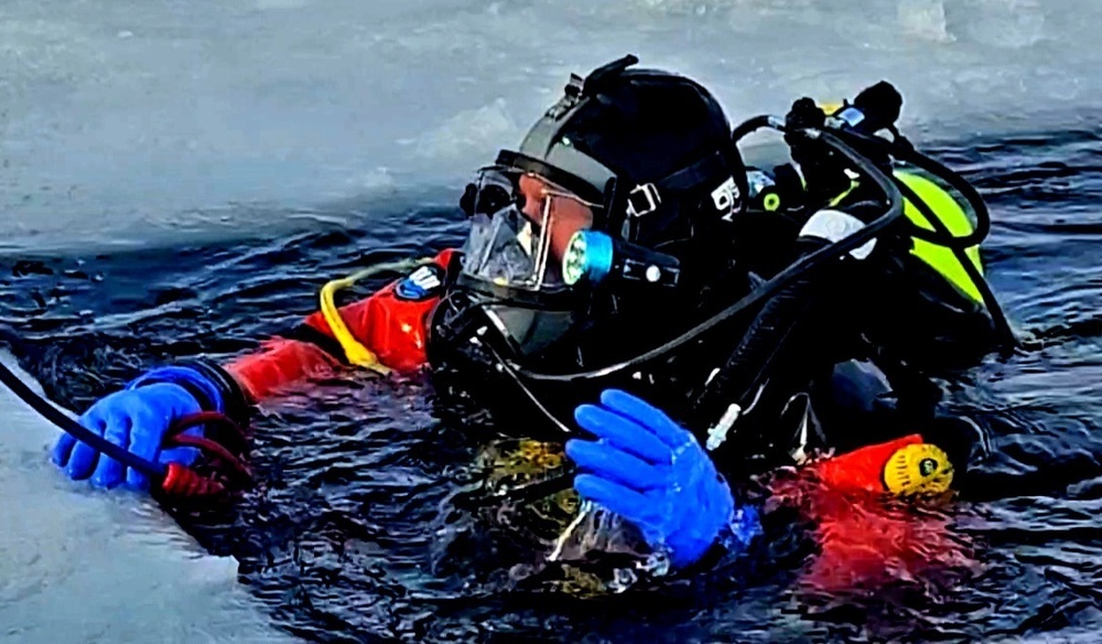 Firefighters on installation fire department dive team participate in ice rescue training at frozen lake at Fort McCoy