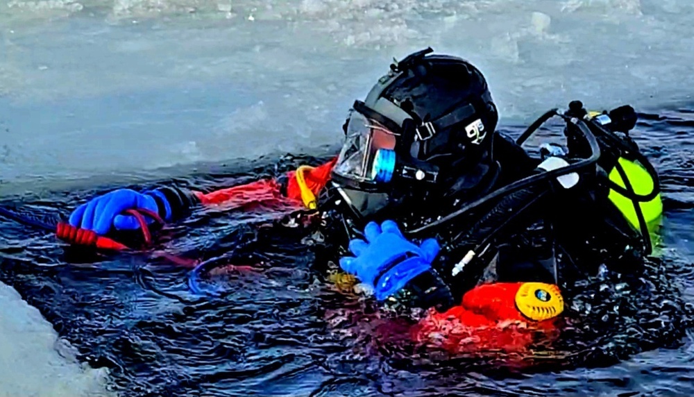 Firefighters on installation fire department dive team participate in ice rescue training at frozen lake at Fort McCoy