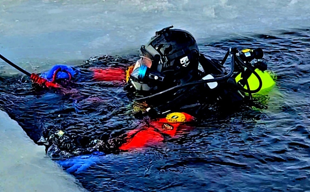 Firefighters on installation fire department dive team participate in ice rescue training at frozen lake at Fort McCoy