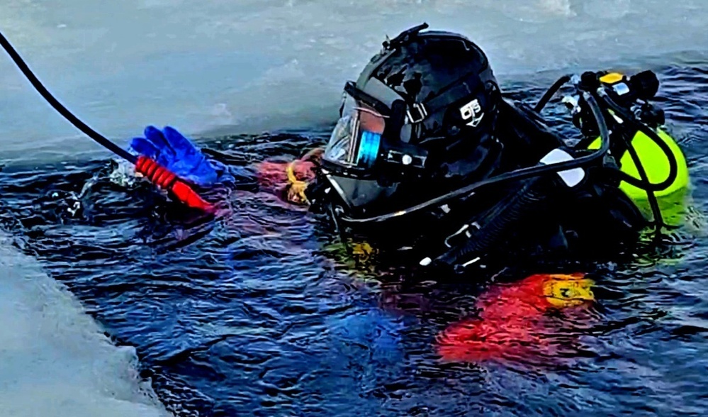 Firefighters on installation fire department dive team participate in ice rescue training at frozen lake at Fort McCoy