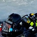 Firefighters on installation fire department dive team participate in ice rescue training at frozen lake at Fort McCoy