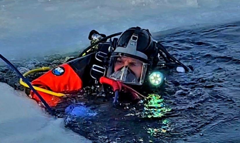 Firefighters on installation fire department dive team participate in ice rescue training at frozen lake at Fort McCoy