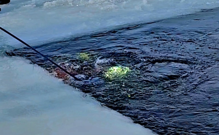 Firefighters on installation fire department dive team participate in ice rescue training at frozen lake at Fort McCoy