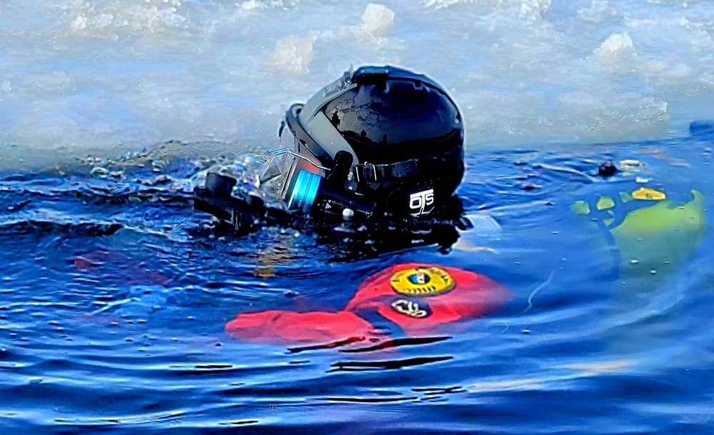 Firefighters on installation fire department dive team participate in ice rescue training at frozen lake at Fort McCoy