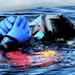 Firefighters on installation fire department dive team participate in ice rescue training at frozen lake at Fort McCoy