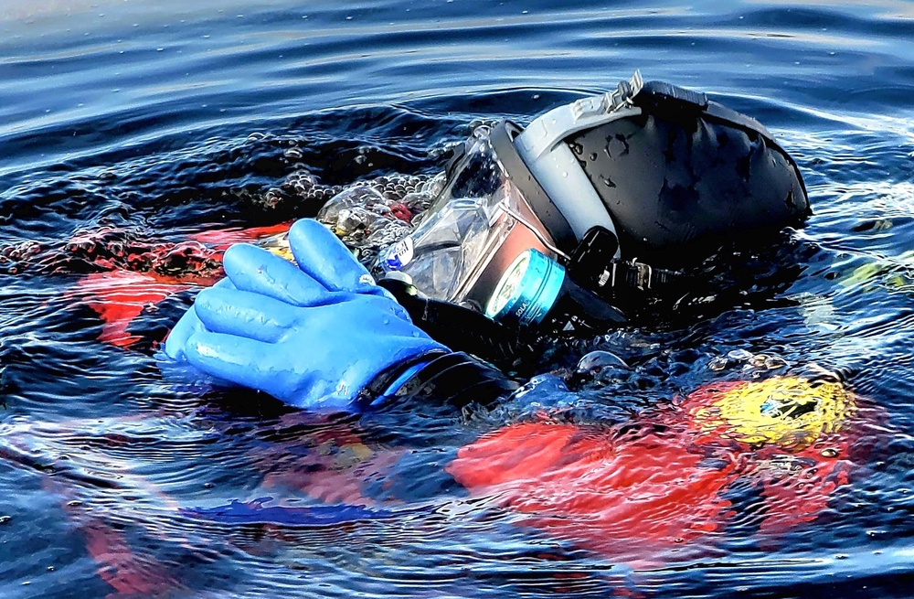 Firefighters on installation fire department dive team participate in ice rescue training at frozen lake at Fort McCoy