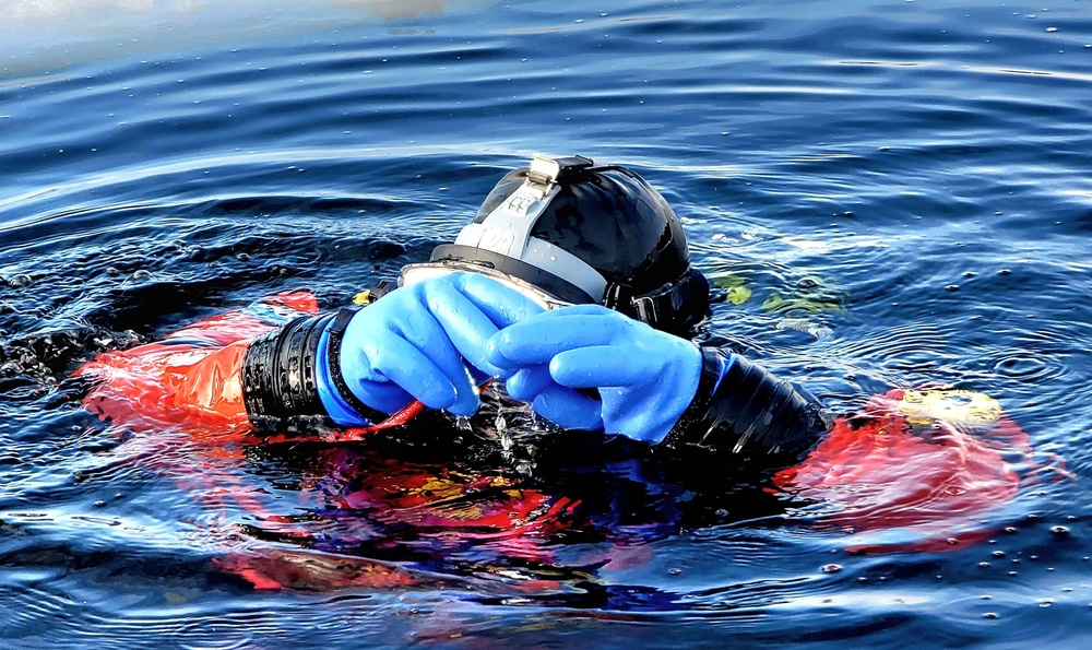 Firefighters on installation fire department dive team participate in ice rescue training at frozen lake at Fort McCoy