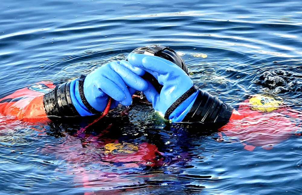 Firefighters on installation fire department dive team participate in ice rescue training at frozen lake at Fort McCoy