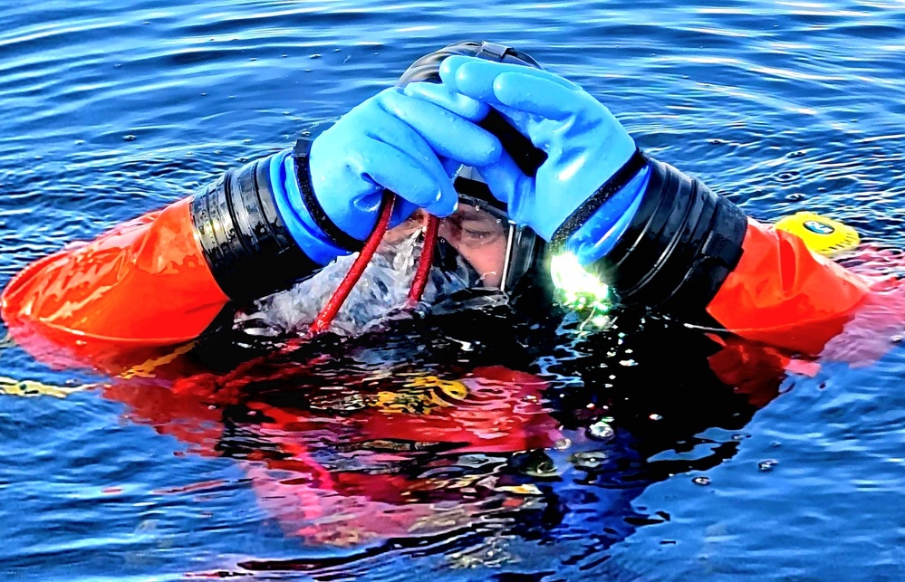 Firefighters on installation fire department dive team participate in ice rescue training at frozen lake at Fort McCoy