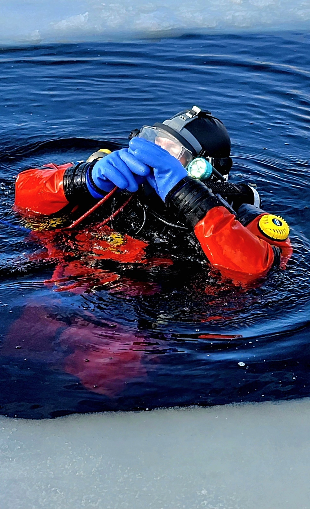 Firefighters on installation fire department dive team participate in ice rescue training at frozen lake at Fort McCoy