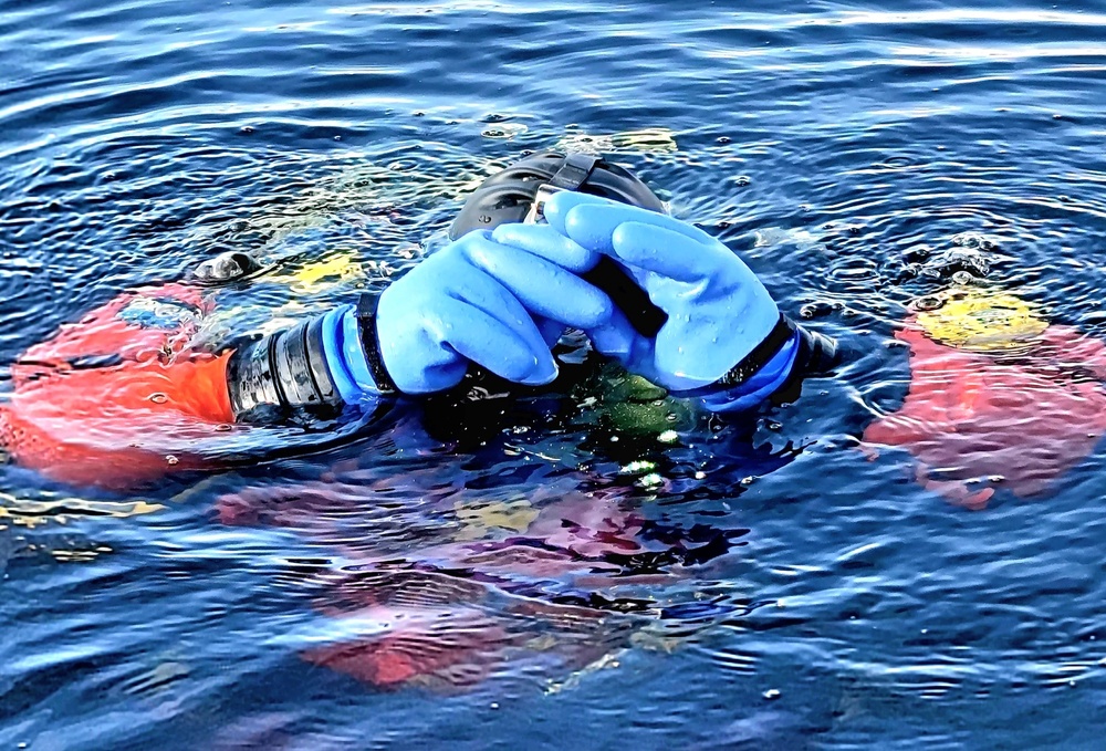 Firefighters on installation fire department dive team participate in ice rescue training at frozen lake at Fort McCoy