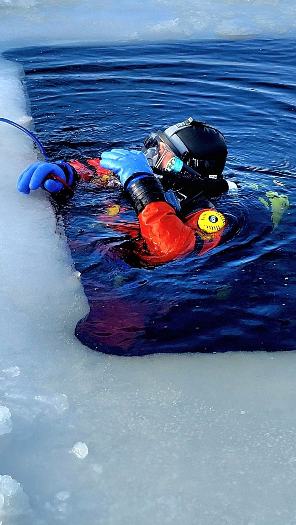 Firefighters on installation fire department dive team participate in ice rescue training at frozen lake at Fort McCoy