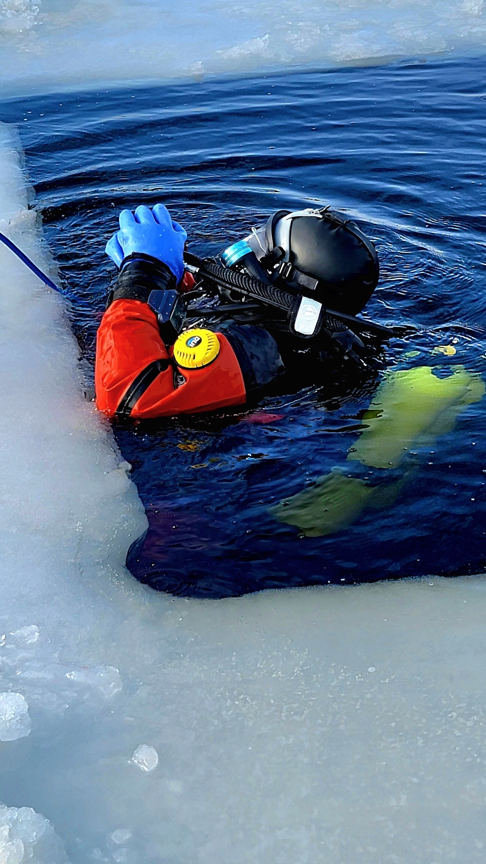 Firefighters on installation fire department dive team participate in ice rescue training at frozen lake at Fort McCoy