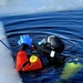 Firefighters on installation fire department dive team participate in ice rescue training at frozen lake at Fort McCoy