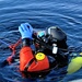 Firefighters on installation fire department dive team participate in ice rescue training at frozen lake at Fort McCoy