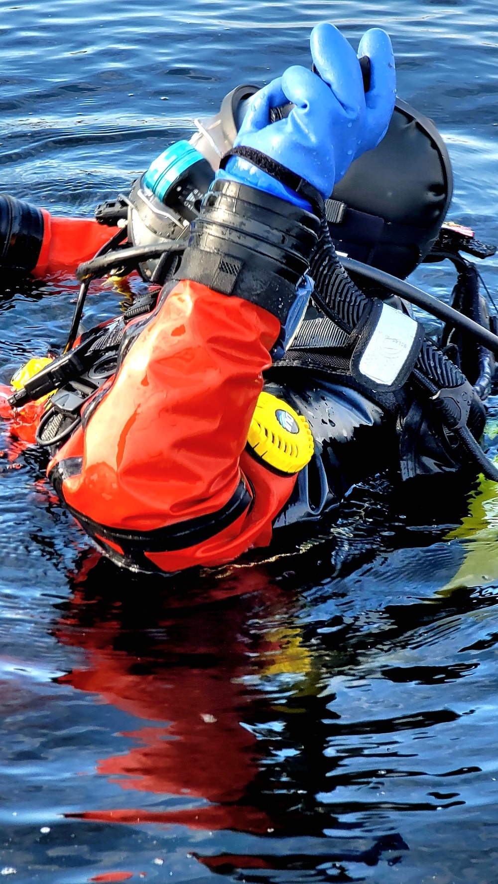 Firefighters on installation fire department dive team participate in ice rescue training at frozen lake at Fort McCoy