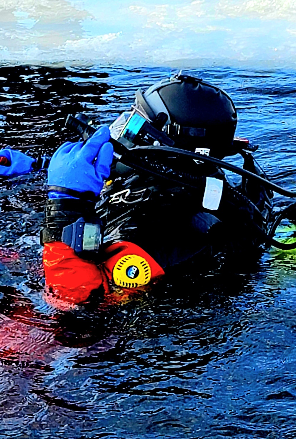 Firefighters on installation fire department dive team participate in ice rescue training at frozen lake at Fort McCoy