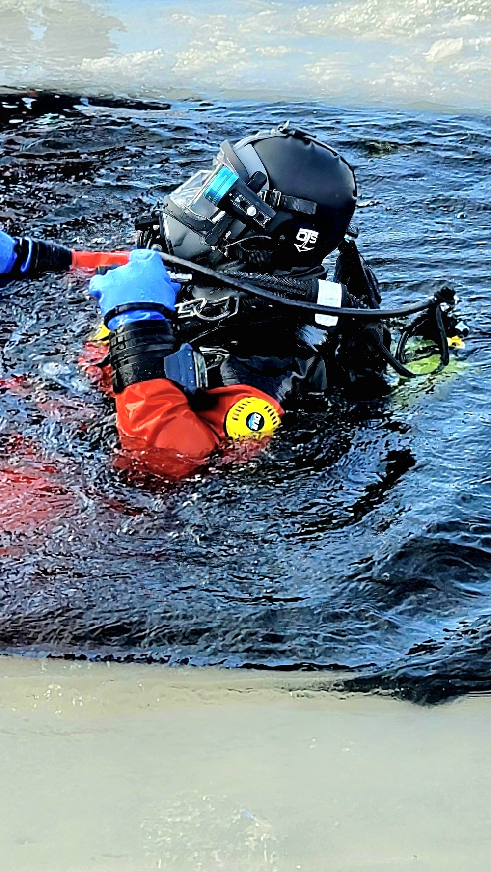 Firefighters on installation fire department dive team participate in ice rescue training at frozen lake at Fort McCoy