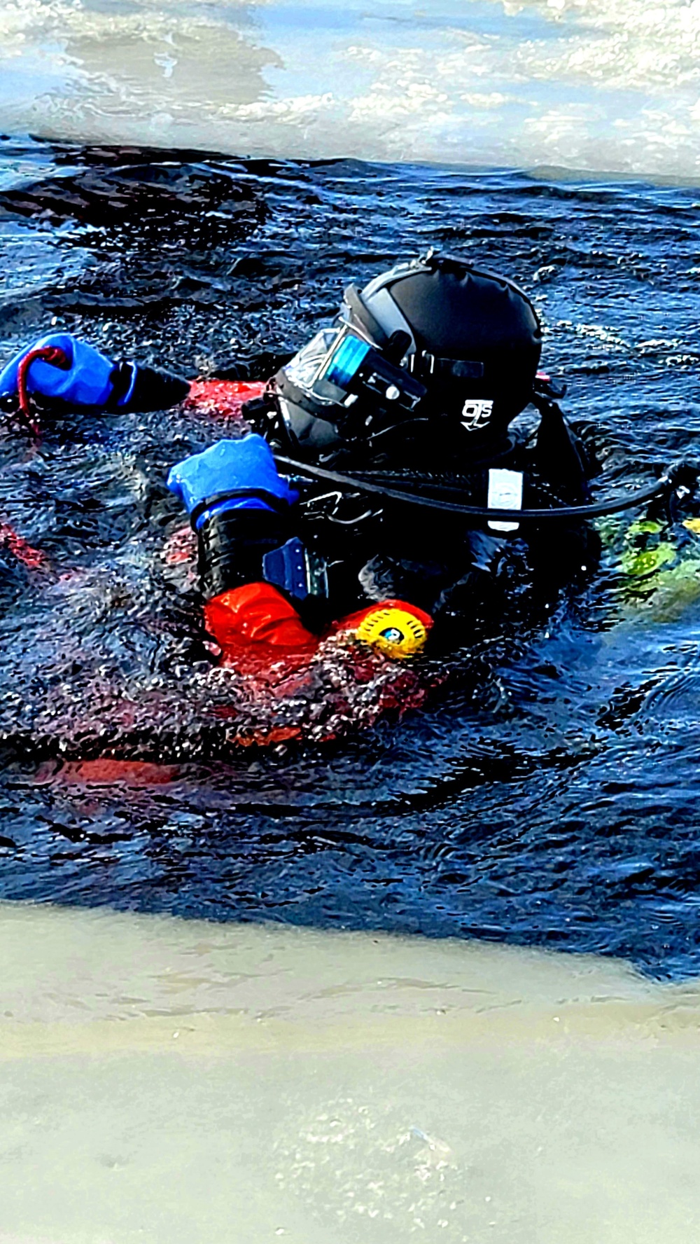 Firefighters on installation fire department dive team participate in ice rescue training at frozen lake at Fort McCoy