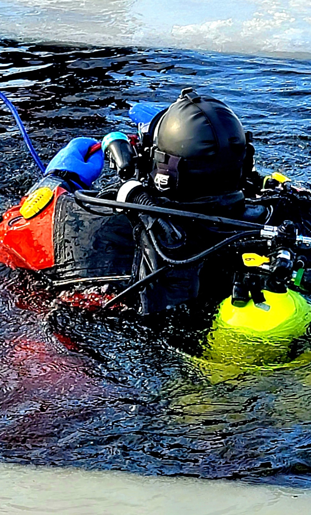 Firefighters on installation fire department dive team participate in ice rescue training at frozen lake at Fort McCoy