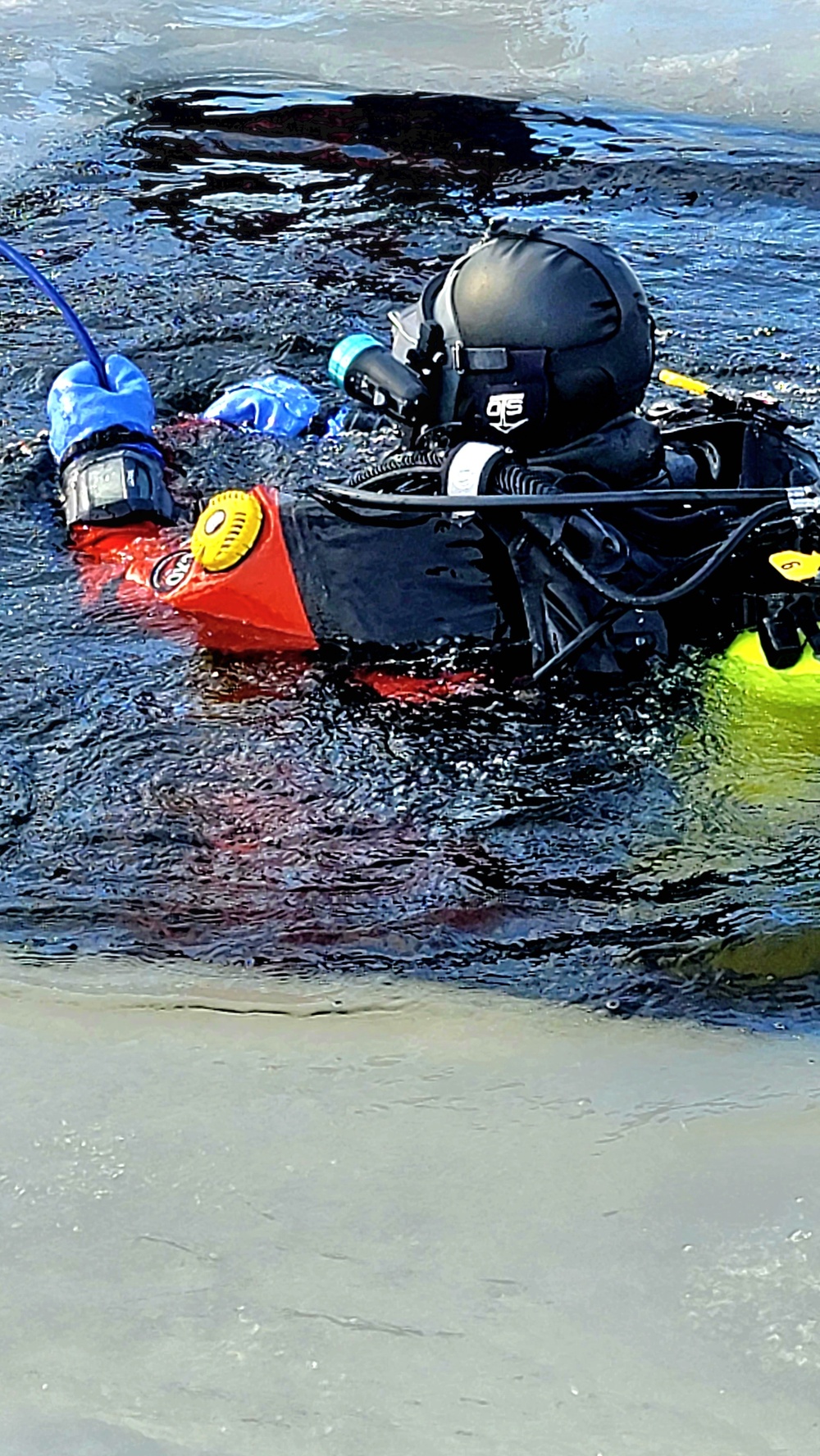 Firefighters on installation fire department dive team participate in ice rescue training at frozen lake at Fort McCoy