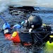 Firefighters on installation fire department dive team participate in ice rescue training at frozen lake at Fort McCoy