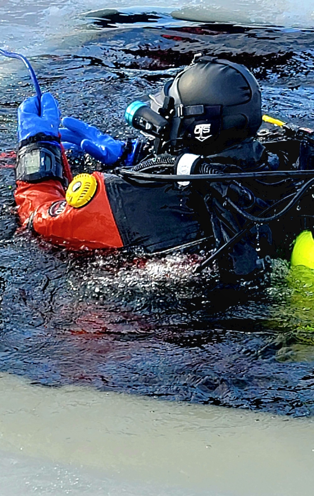 Firefighters on installation fire department dive team participate in ice rescue training at frozen lake at Fort McCoy