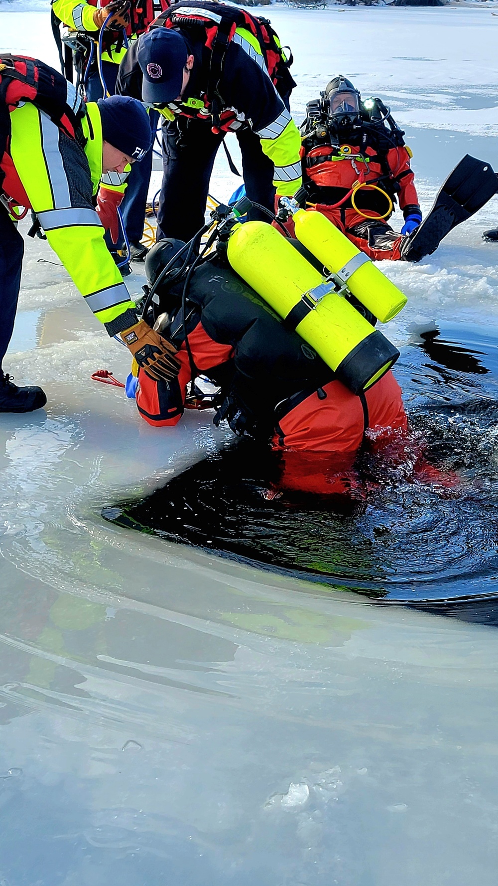 Firefighters on installation fire department dive team participate in ice rescue training at frozen lake at Fort McCoy