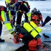 Firefighters on installation fire department dive team participate in ice rescue training at frozen lake at Fort McCoy