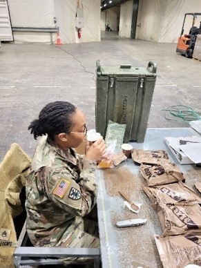Staff Sgt. Lenee Williams, veterinary food inspector at Public Health Activity- Rheinland Pfalz, examining the drink mixes that are part of the MRE to assess if a shelf-life extension can be granted.